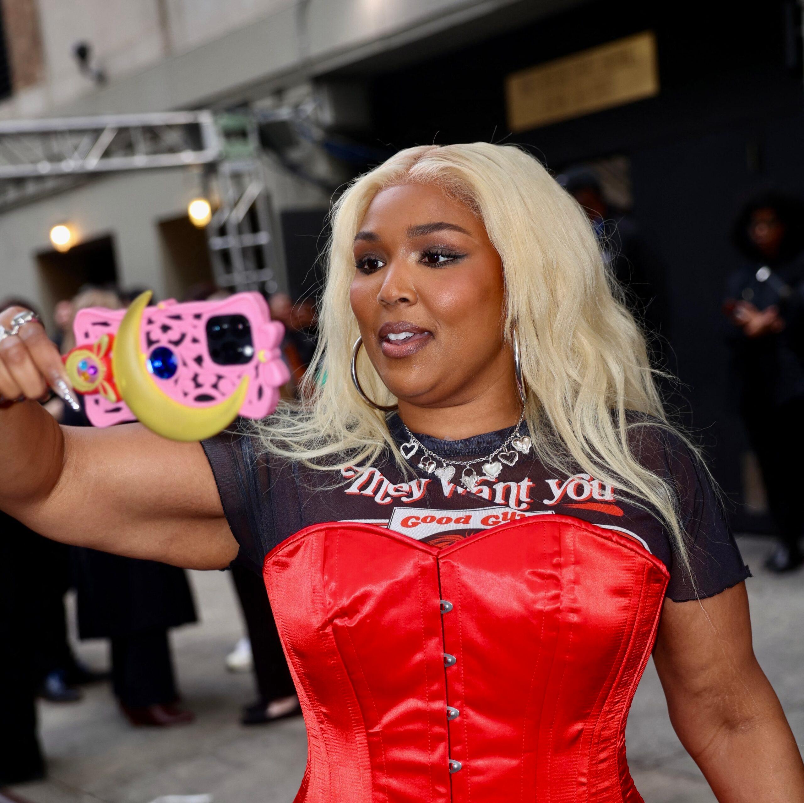 Lizzo highlights trim waist and weight loss in red corset as she leads the stars at Amazon 2025 Upfronts