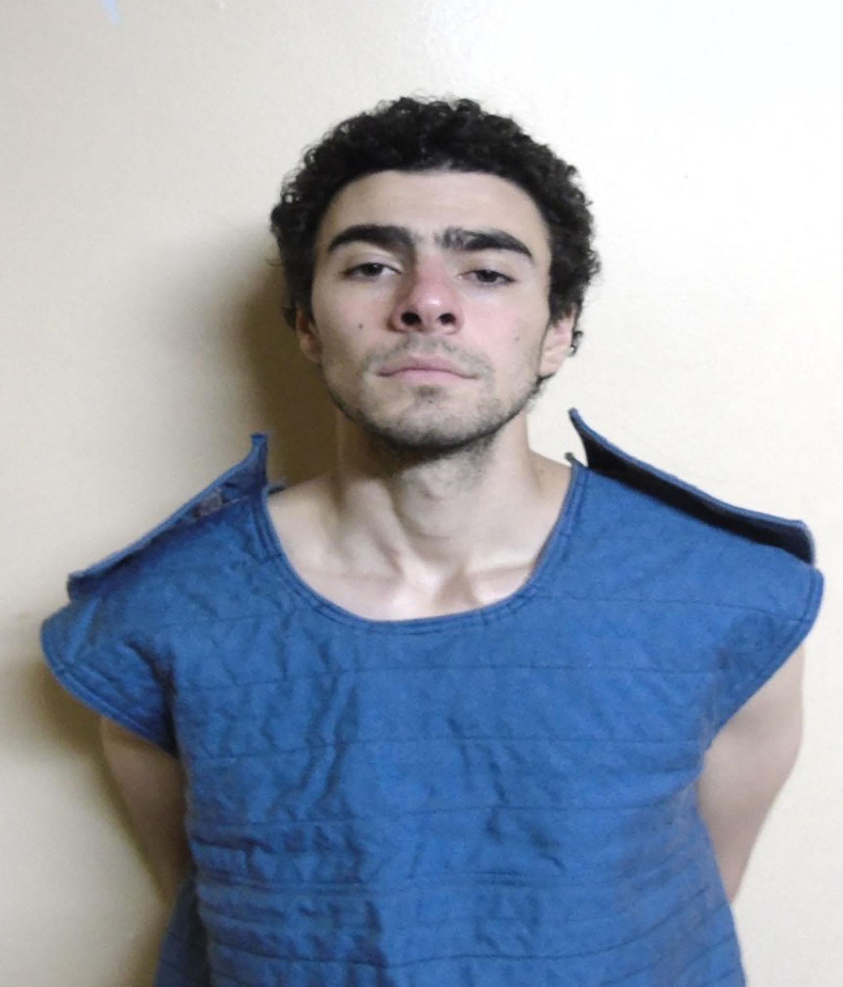 Luigi Mangione wears padded vest in mugshot after his arrest over murder of United Healthcare CEO in Altoona, Pennsylvania