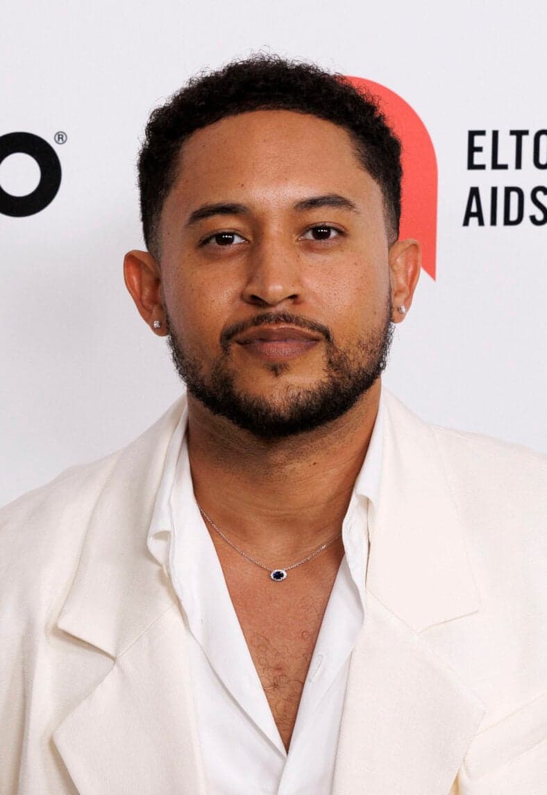 Tahj Mowry posing on the red carpet. 