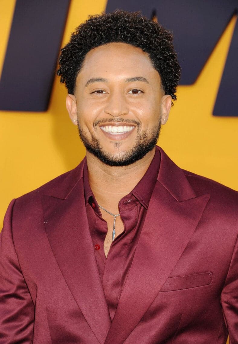 Tahj Mowry posing on the red carpet. 
