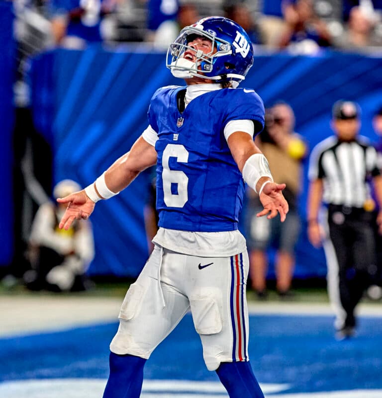 New York Giants quarterback Jaxson Dart (6) reacts after scoring a touchdown during a preseason game against the New York Jets at MetLife Stadium